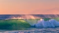 Colorfull wave crashing at sunset