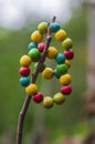 Colorfull wood beads on thread, fashionable beaded bracelets, bright beautiful colors green red yellow and light blue