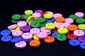 colorfull wooden buttons with black background Royalty Free Stock Photo