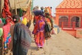 Procession of Colorful Female Pilgrims Along Ganges, India