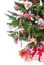 Colorfully decorated isolated Christmas tree with red decoration Royalty Free Stock Photo