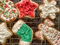 Colorfully iced, homemade Christmas cookies on a wire rack