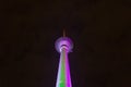 Colorfully Illuminated Berlin Tower at Night