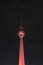 Colorfully Illuminated Berlin Tower at Night