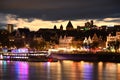 Colorfully illuminated Cologne Old Town and the banks of the Rhine at night in Cologne