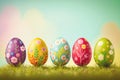 Colorfully painted row of Easter eggs sitting on the grass Royalty Free Stock Photo