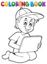 Coloring book boy playing with tablet Royalty Free Stock Photo