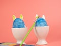 Coloring Easter eggs. Decorate eggs for Easter on a pink background. Royalty Free Stock Photo