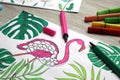 Coloring page with children drawing and set of felt tip pens on wooden table, closeup Royalty Free Stock Photo