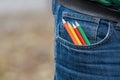 Coloring pencils in a back jeans pocket Royalty Free Stock Photo