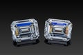 Colorless transparent sparkling set of two luxury gemstones square shape emerald cut diamonds on black background Royalty Free Stock Photo