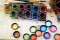 Colors in the palette of the painter and brushes to paint the pi Royalty Free Stock Photo