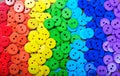 Colors of rainbow. Pattern of multicolored buttons texture background Royalty Free Stock Photo