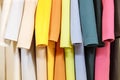 The colors of the rainbow. The selection of fashionable coats on hangers in the store. Royalty Free Stock Photo