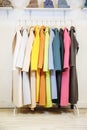 The colors of the rainbow. The selection of fashionable coats on hangers in the store. Royalty Free Stock Photo