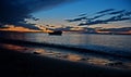 colors reflected on the shoreline as the waves retreat, evening and night colors after sunset, Royalty Free Stock Photo