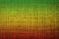 Colors of reggae on the fabric background.