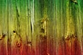 Colors of reggae on the wood background.