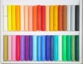 Colors. A set of colorful oil pastels in box. Crayons 36 colors top view Royalty Free Stock Photo