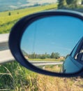 Colors of Tuscany countryside as seen from car mirror Royalty Free Stock Photo