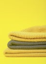 Colors of the year 2021 Ultimate Gray and Illuminating background. Gray and Illuminating .winter hats on a yellow background.