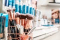 Colorscience tester products on retail display at a makeup counter store, selling the cosmetics. Silver and blue branded packaging