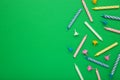 Coloruful birthday candles on green background. Birthday celebration. Spsce for text Royalty Free Stock Photo