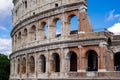 Colosseum with clear blue sky and clouds, Rome