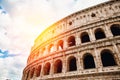 Colosseum or Coliseum ancient ruins background blue sky Rome, Italy, stone arches and sunset Royalty Free Stock Photo