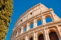 Colosseum or Coliseum ancient ruins background blue sky Rome, Italy, stone arches and sunset Royalty Free Stock Photo