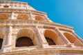 Colosseum or Coliseum ancient ruins background blue sky Rome, Italy, stone arches and sunset Royalty Free Stock Photo