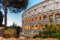 Colosseum, or Coliseum. Illuminated huge Roman amphitheatre early in the morning, Rome, Italy Royalty Free Stock Photo