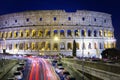 Colosseum lit at night.