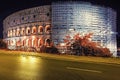 Colosseum with scaffolding under restoration at night Rome, Italy Royalty Free Stock Photo