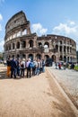 The Colosseum. A tourists group. Crowd of people.