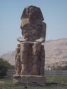 Colossi of Memnon - a massive stone statue of the pharaoh Amenhotep III, who ruled in Egypt during the XVIII dynasty. Luxor, Egypt Royalty Free Stock Photo