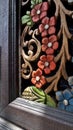 Colour flower wood carving on teak wood cabinet Royalty Free Stock Photo