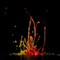 Colour paint splashes isolated on black background Royalty Free Stock Photo