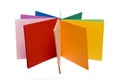 Colour pencils and colored notebook Royalty Free Stock Photo