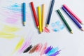 Colour pencils on white paper background paint education concept - wooden crayon multicolored drawings