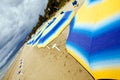 Colour sunshades on a empty beach