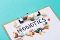 Colour tablets and pills on blue background probiotic theme - Image