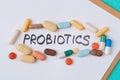 Colour tablets and pills on blue background probiotic theme - Image