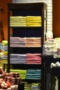 Colour towel stacked neatly on the shelf in fashion shop Royalty Free Stock Photo
