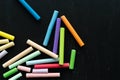 Coloured chalks on a black background. Back to class. Copy space Royalty Free Stock Photo