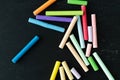 Coloured chalks on a black background. Back to class. Copy space Royalty Free Stock Photo