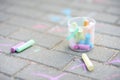 Coloured chalks on a sidewalk Royalty Free Stock Photo