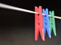 Coloured clothes pegs on washing line Royalty Free Stock Photo