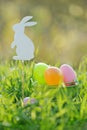 Coloured Easter Eggs In Basket Padded Out With Rabbit Decorations Royalty Free Stock Photo