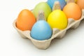 Coloured easter eggs in the box on wooden background Royalty Free Stock Photo